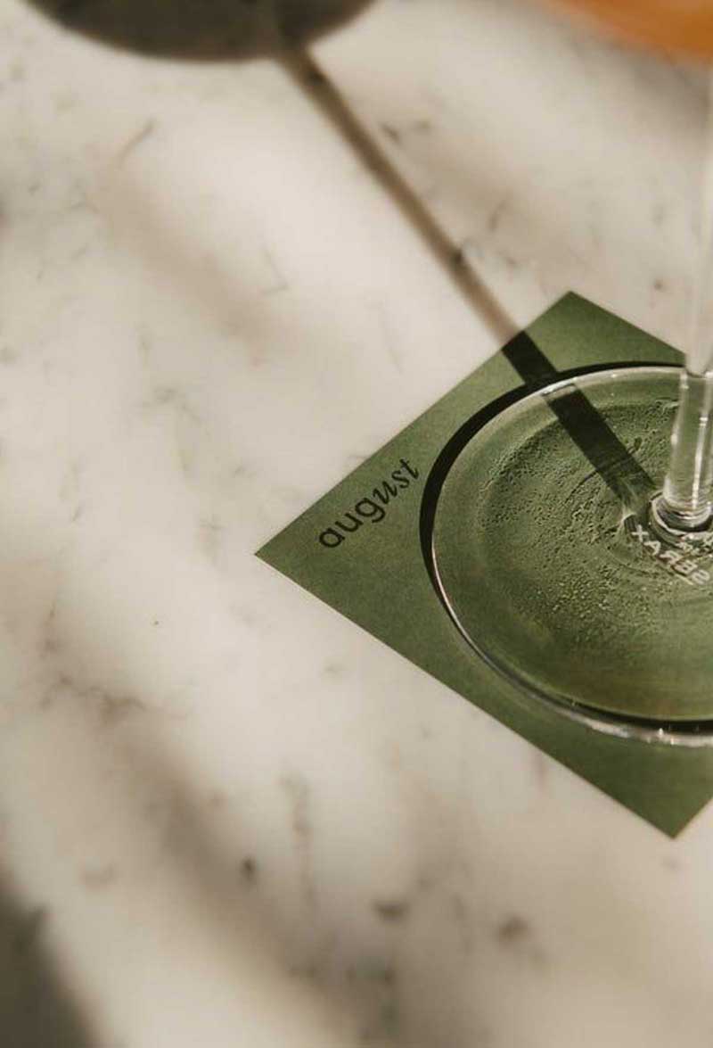 decorative image of the shadow of a glass on a marble table