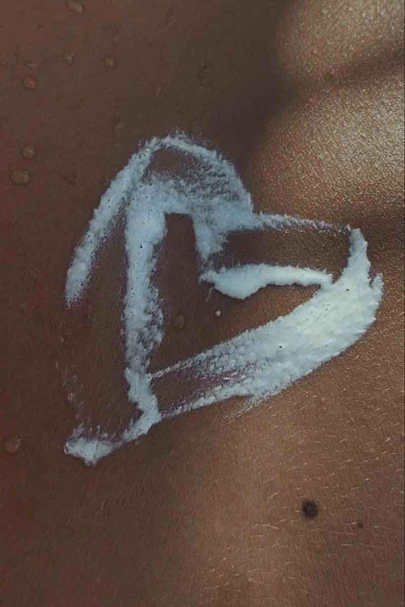 skin care as prevention to acne outbreaks picture showing a healing cream on skin