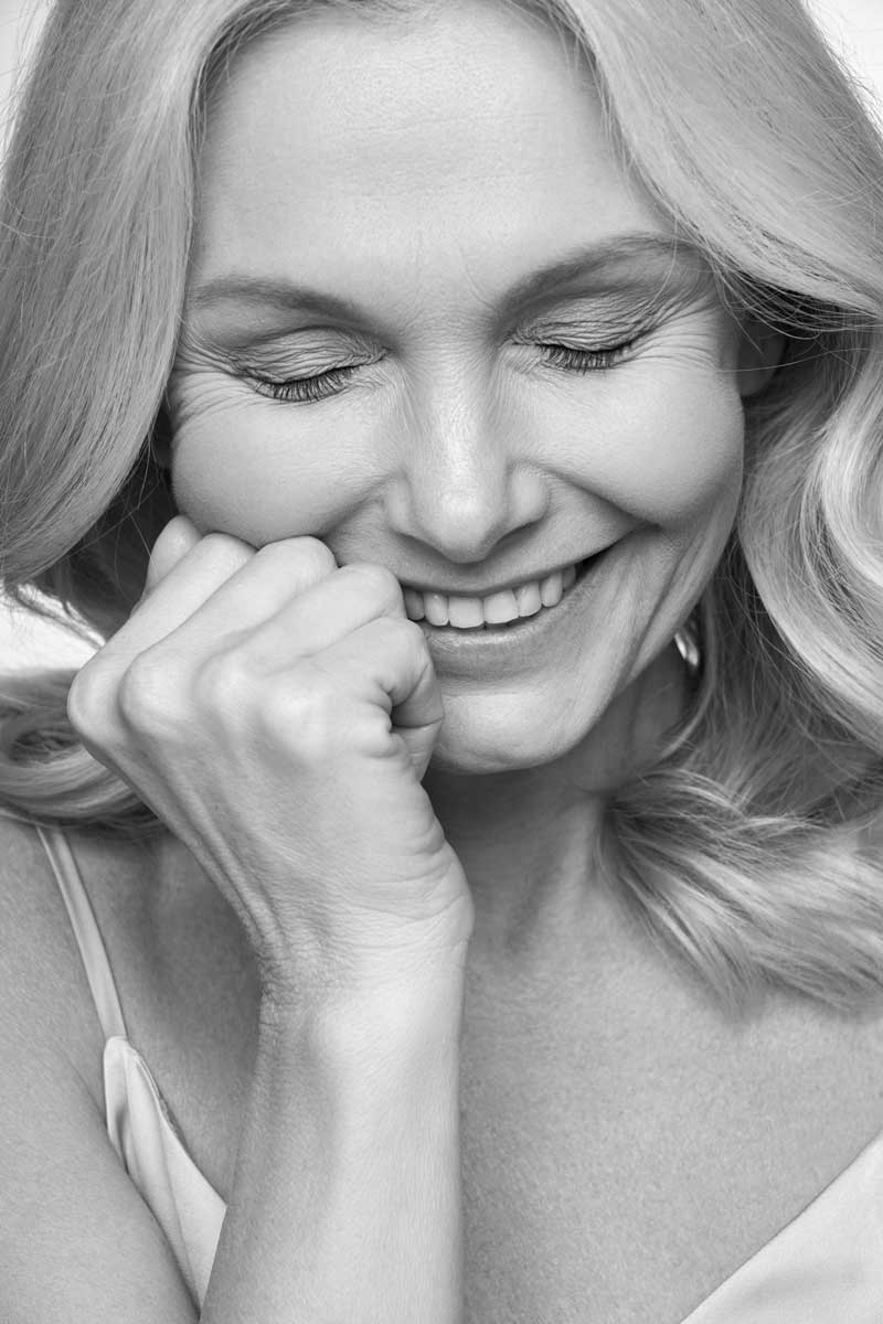 black and white picture of a mature woman with fine lines and wrinkles