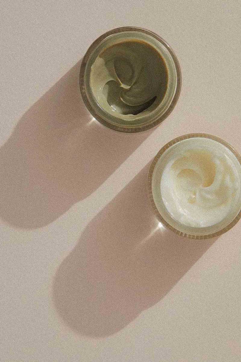 image of tins of natural ingredients blended into acne-fighting compounds