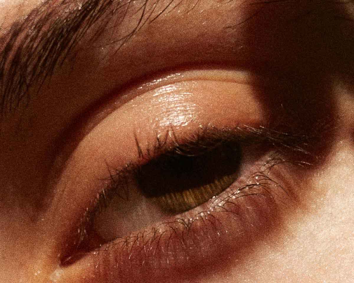 cover image for the article how to get rid of eye bags showing the healthy eye of a young woman