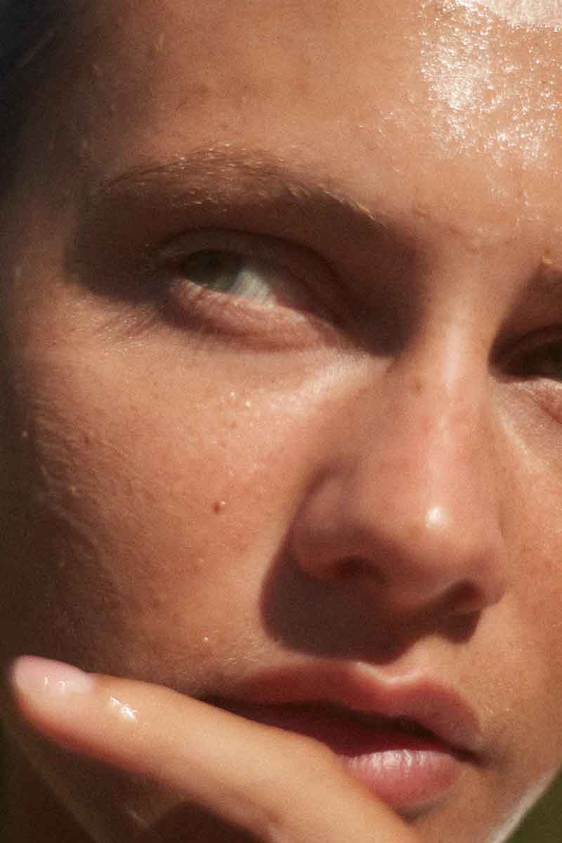 decorative picture of a woman's face as the rosegel and mulberry extract face mask is sitting on her skin