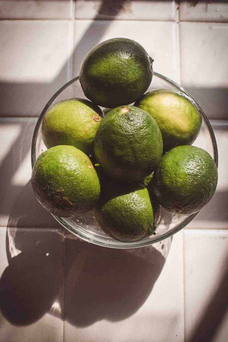 picture of a lime filled glass bowl on a kitchen top<br />
