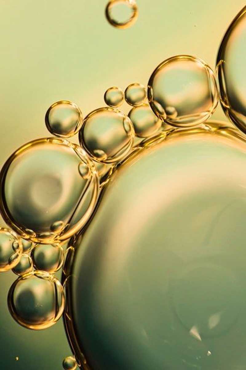 decorative image of a closeup of a skincare oil made of clean natural ingredients<br />
