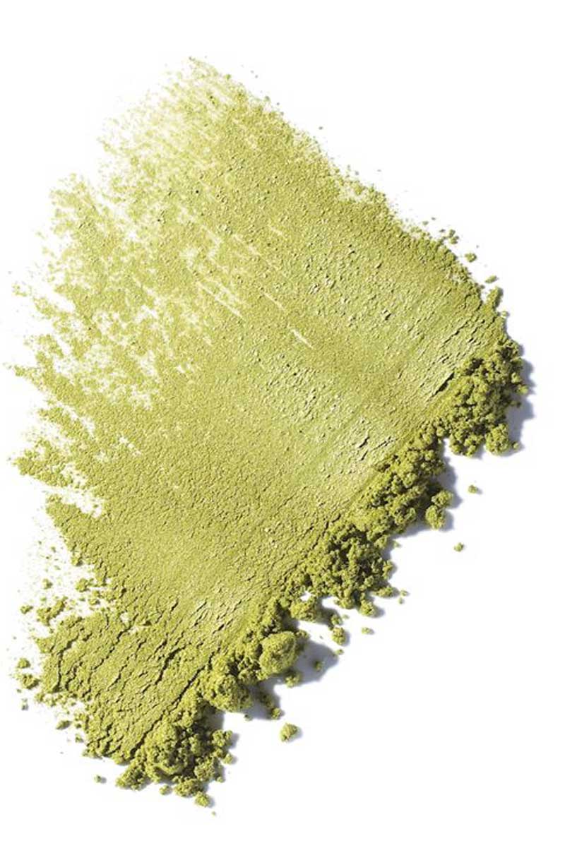 Decorative image of green powder on white background