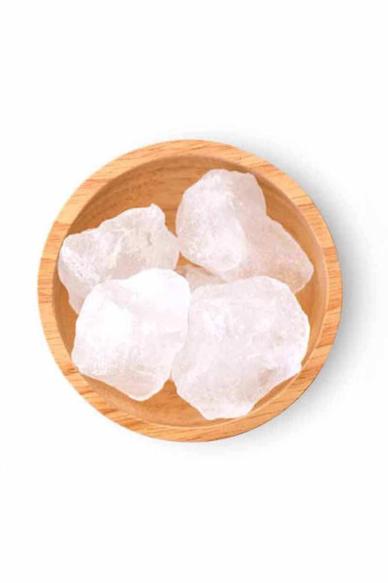 picture of a bowl full of minerals used to deal with acne like calcium and quartz
